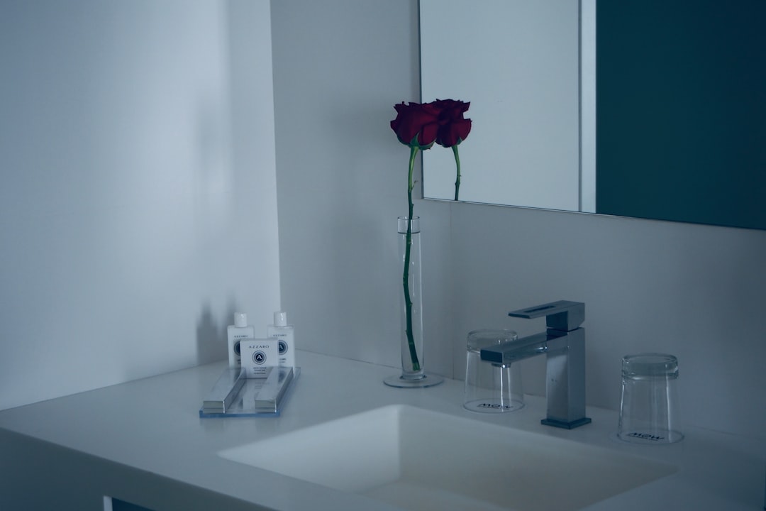 Clean white bathroom countertop with oral hygiene essentials