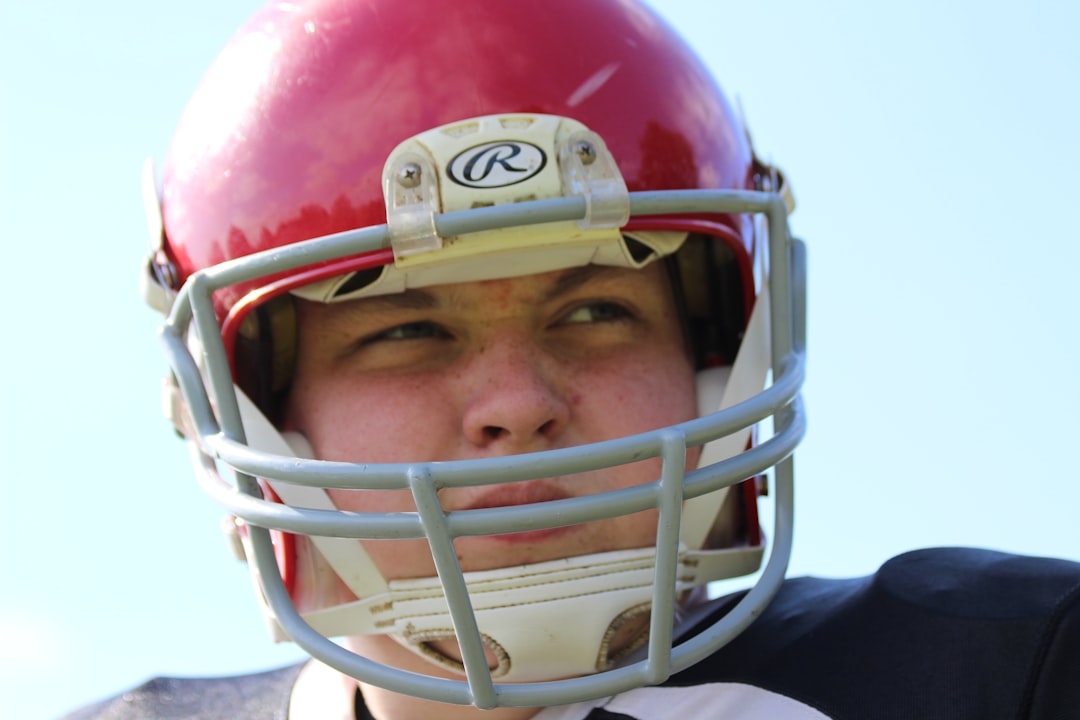 Football athlete wearing a protective helmet on the field