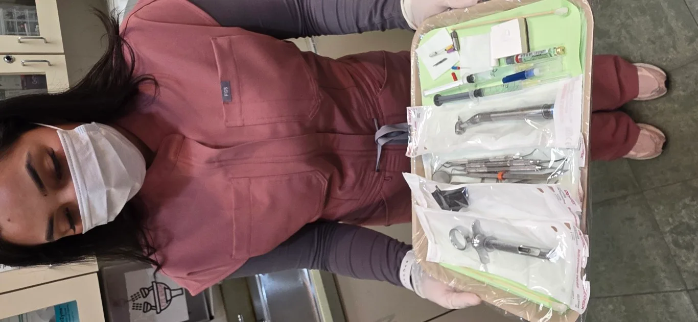 Dental assistant preparing sterilized instruments at Peninsula Dentistry