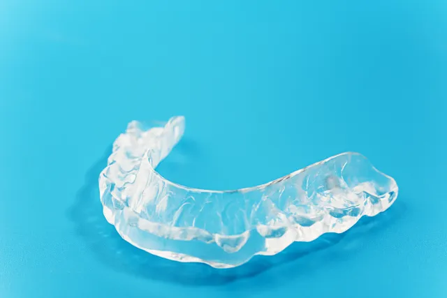 Clear custom dental nightguard designed to protect teeth from grinding and bruxism