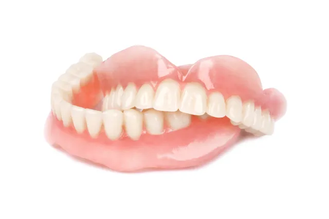 Set of complete dentures showing upper and lower dental prosthesis